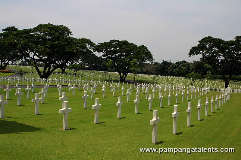 Grave plots arranged in concentric rings around the Manila American Cemetery and Memorial.