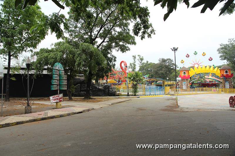 Directional Signs with Circle of Fun Rides on the Right Side in Quezon Memorial Circle in Quezon City.