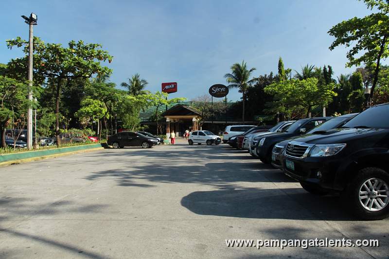 Parking Area of Quezon Memorial Circle with Restaurants Area in Background.