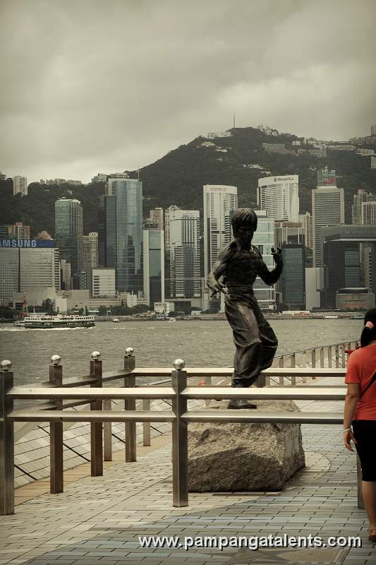 Bruce Lee Statue on Avenue of Stars (front view with Hong Kong Island background)