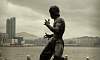 Bruce Lee Statue on Avenue of Stars (Back view with Kowloon background)  Location: Kowloon - Hong Kong